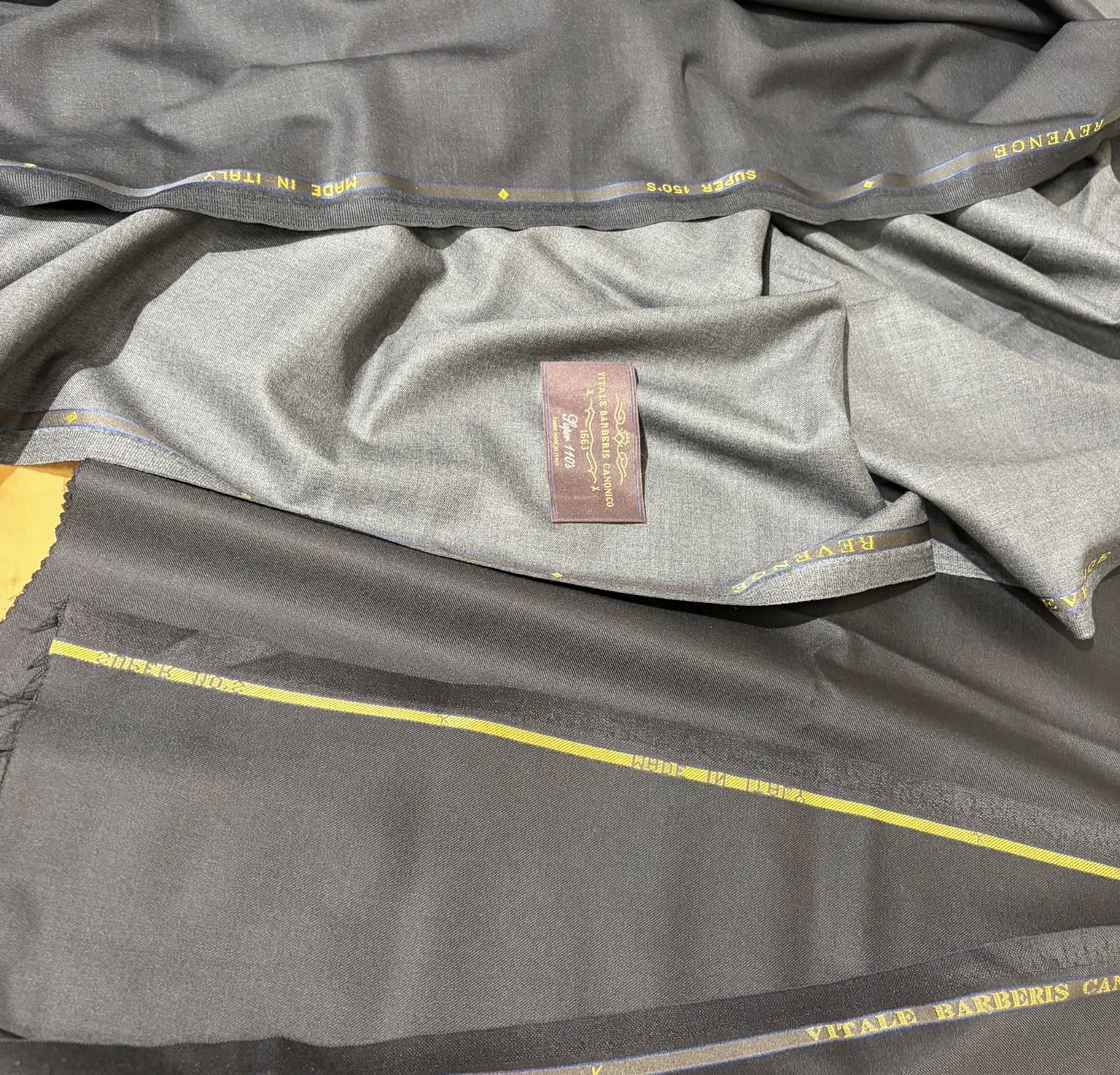 Grey jacket lining and inner label detail | Chi tiết lớp lót và nhãn bên trong áo khoác xám