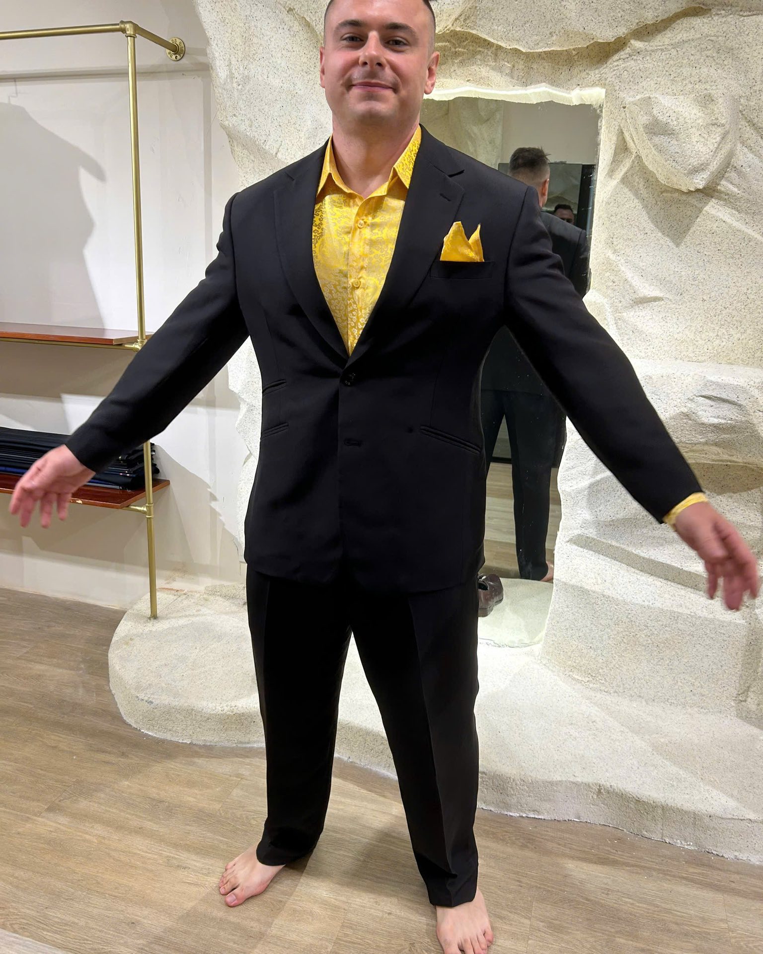 Client wearing a fitted black suit with yellow shirt | Khách hàng mặc suit đen vừa vặn cùng sơ mi vàng