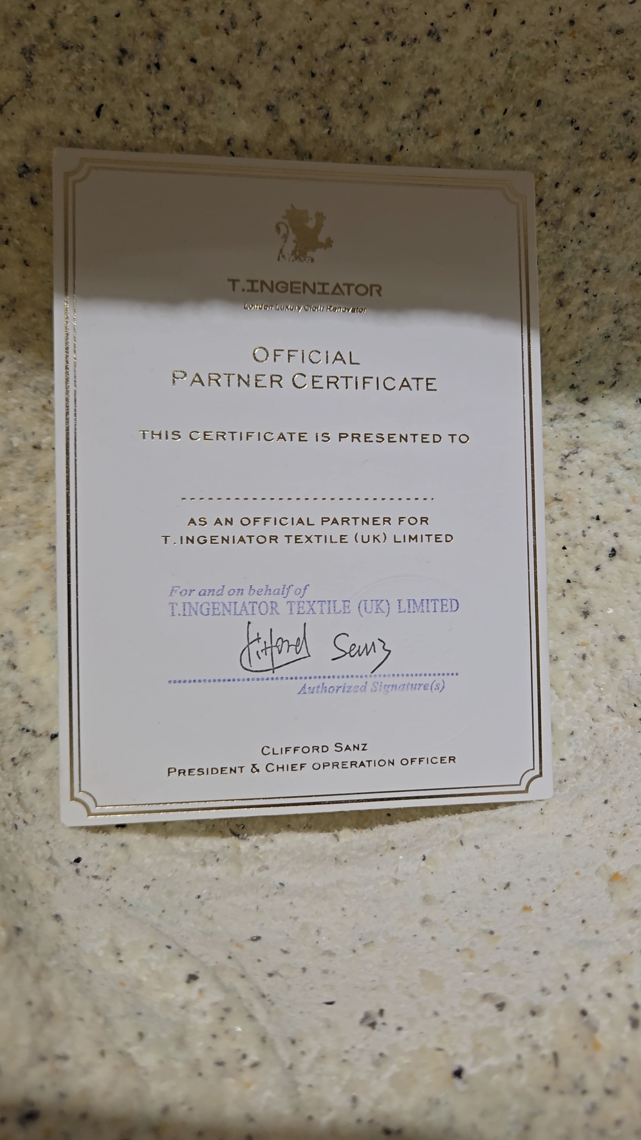 Official partner certificate displayed at S.T Tailor | Chứng nhận đối tác chính thức trưng bày tại S.T Tailor