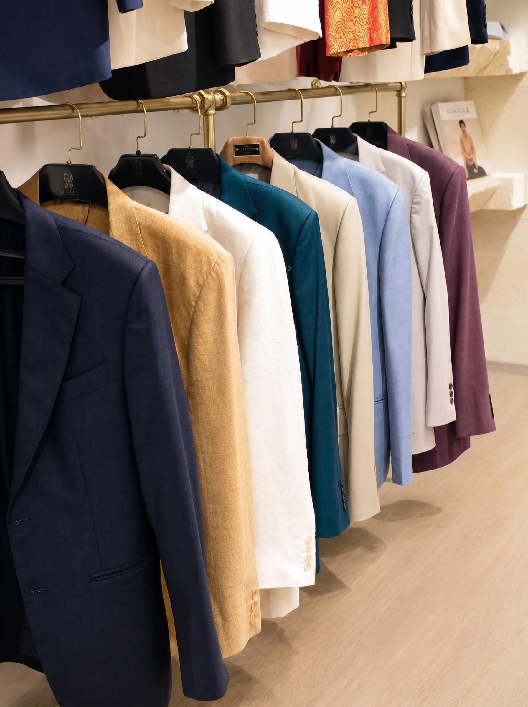 Garments on a showroom rail | Trang phục trên giá treo tại showroom